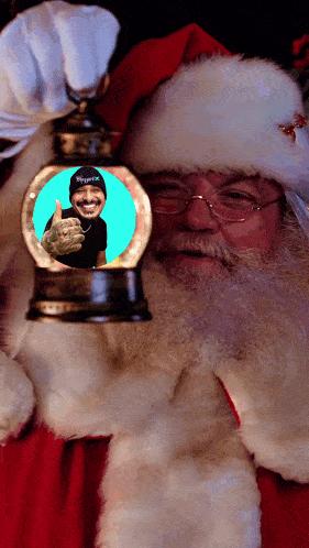 santa claus holding a snow globe with a picture of a man in it