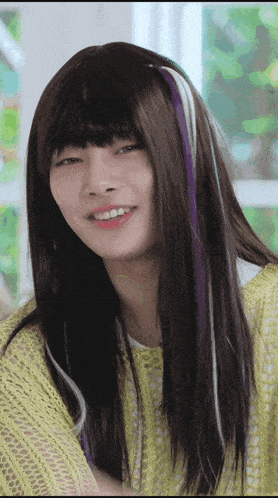 a woman wearing a wig with purple and white streaks