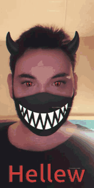 a man wearing a mask with devil horns and the word hellew on the bottom