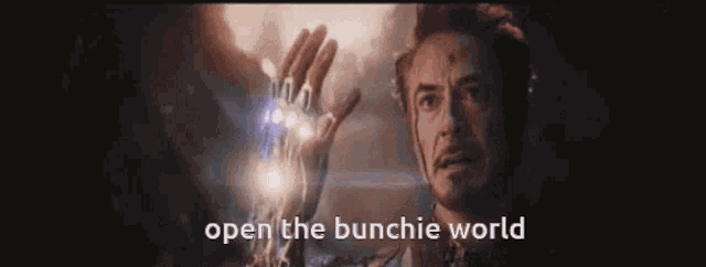 a man is holding something in his hand with the words open the bunchie world written above him