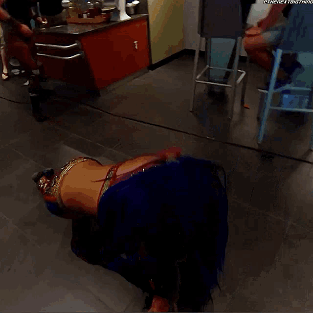 a woman is laying on the floor in a room with a watermark that says @thenextbig thing