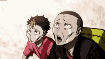 a man and a boy are standing next to each other with their mouths open and making funny faces .