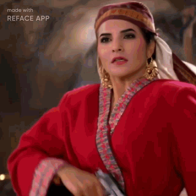 a woman in a white and gold costume is dancing in front of a man .