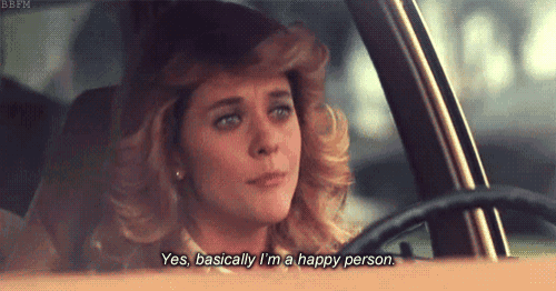 a woman is sitting in a car and says yes basically i 'm a happy person