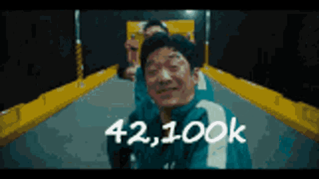 a man in a boxing ring with the number 42,100k written on the bottom