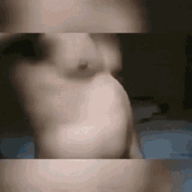 a close up of a person 's face with a blurred background .