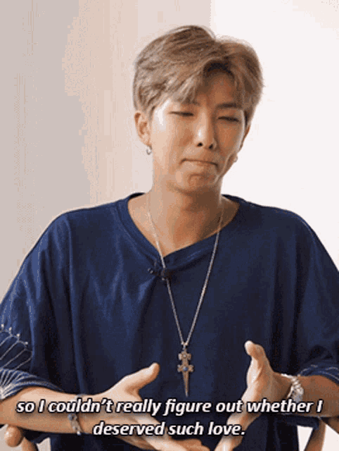 a man in a blue shirt says " so i couldn't really figure out whether i deserved such love