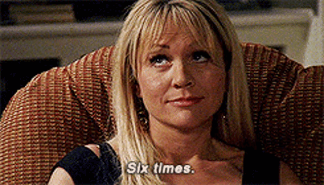 a woman is sitting in a chair and says six times .