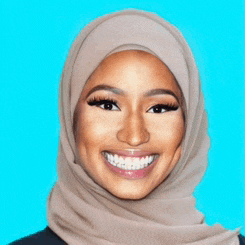 a woman wearing a hijab is smiling and wearing braces