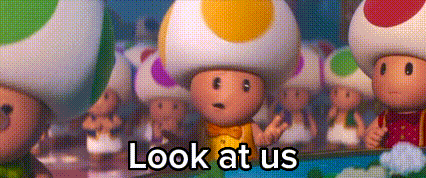 a group of toads are standing next to each other with the words `` look at us '' .