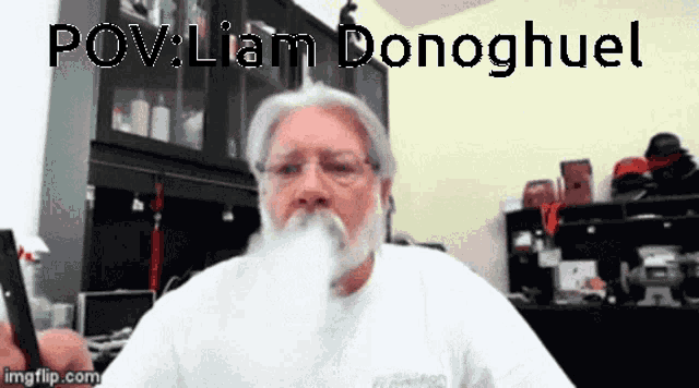 a man with a beard is smoking a cigarette with the caption pov liam donghuel