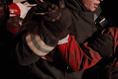 a fireman wearing a jacket with the word kask on the back
