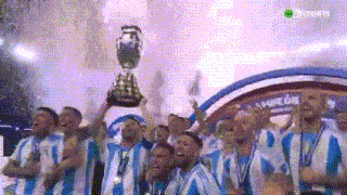 a group of men in blue and white striped shirts are holding a trophy in their hands