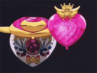 a pink heart with a crown on top of it