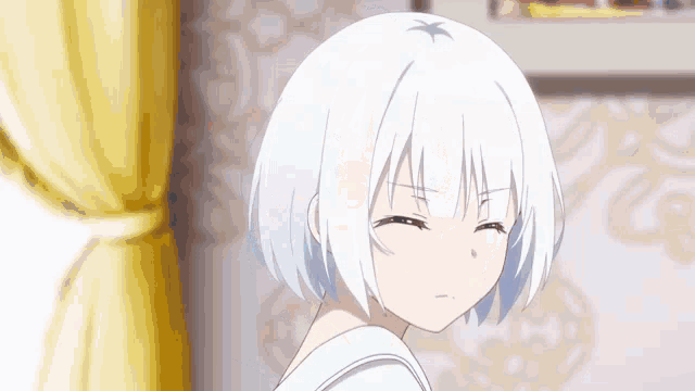 a girl with white hair is making a funny face in a room with a yellow curtain .