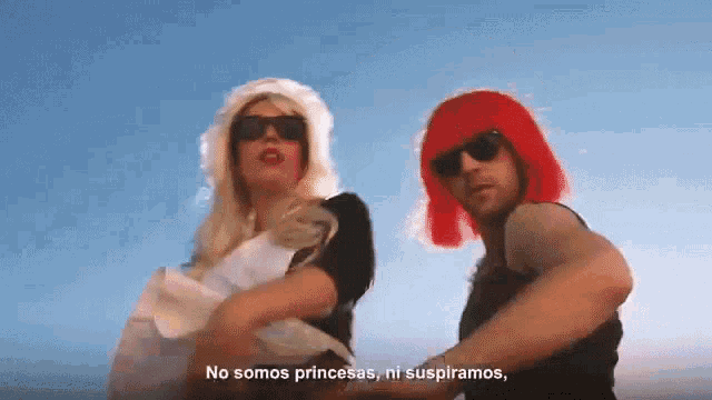a man and a woman are dancing in front of a blue sky with the words no somos princesas ni suspiramos