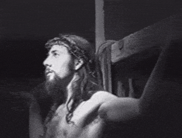 a man with a crown of thorns on his head is standing next to a sign that says hello