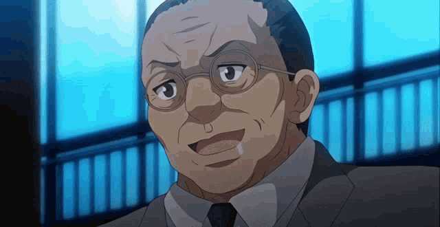 a man in a suit and tie with glasses looks angry