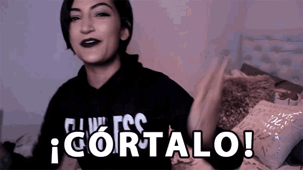 a woman in a black hoodie says cortalo in white letters