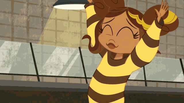 a girl in a yellow and brown striped shirt is standing in front of a wall
