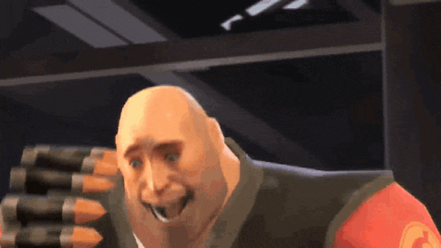 a bald man in a red shirt is smiling and holding a bullet belt