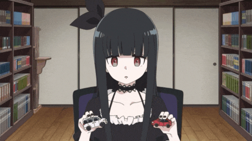 a girl with black hair and red eyes is holding two toy cars