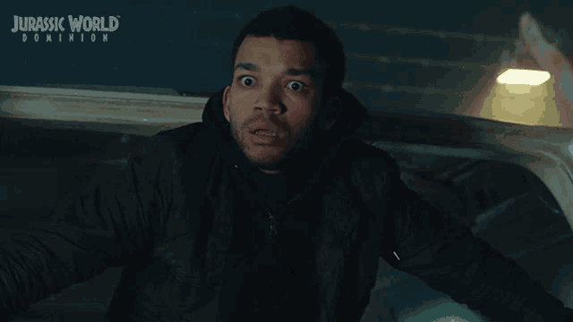 a jurassic world dominion poster with a man yawning and the word nope