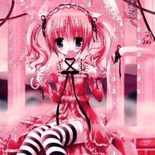 a girl in a pink dress and black and white striped thigh high socks is sitting on a brick wall .