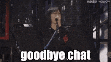 a woman singing into a microphone with her arms in the air and the words goodbye chat below her