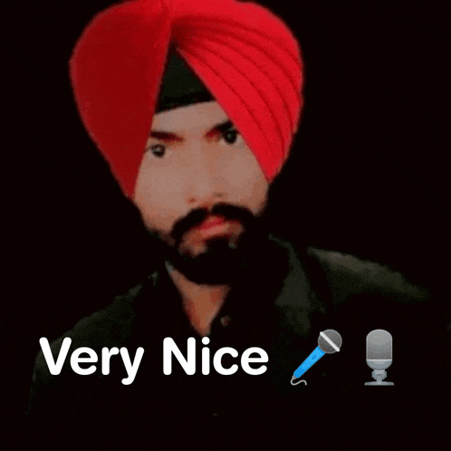 a man in a red turban is talking into a microphone .