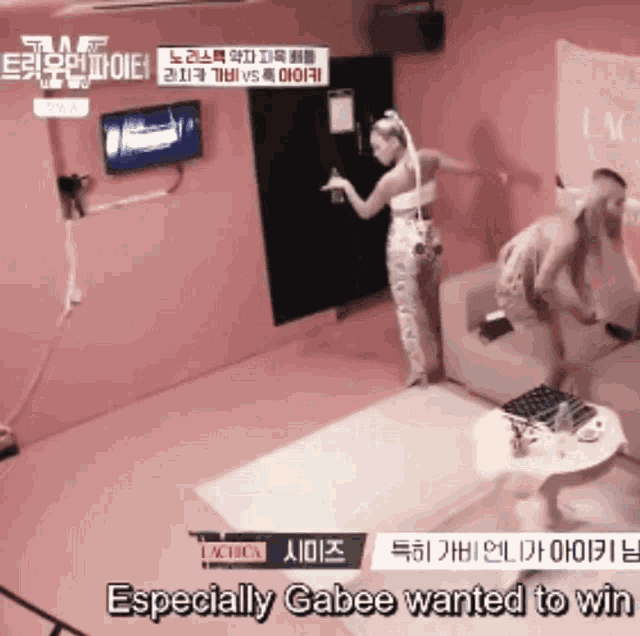 a woman standing on a couch with the words " especially gabee wanted to win " on the bottom