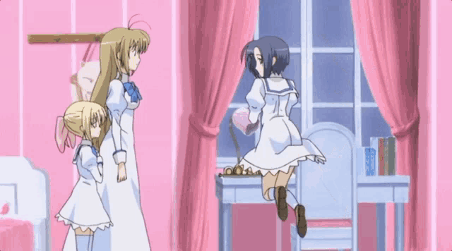 a girl in a white dress is standing next to a girl in a blue dress