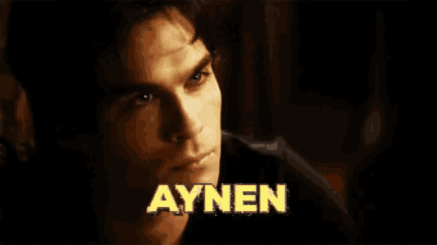 a close up of a man 's face with aynen written on the bottom
