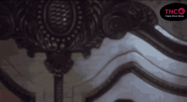 a tng logo can be seen in the corner of a painting