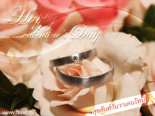 a happy valentine 's day greeting card with two wedding rings on roses