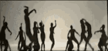 a group of people are dancing in front of a white background .