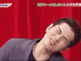 a man is making a funny face with his eyes closed