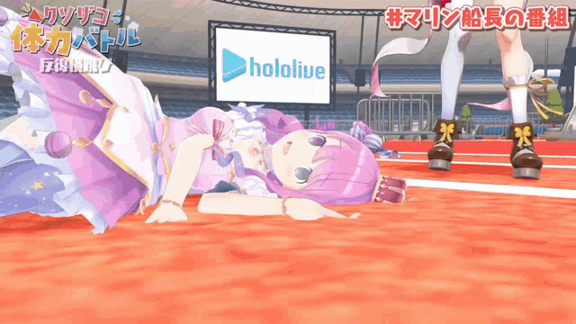 a girl laying on the ground in front of a hololive banner