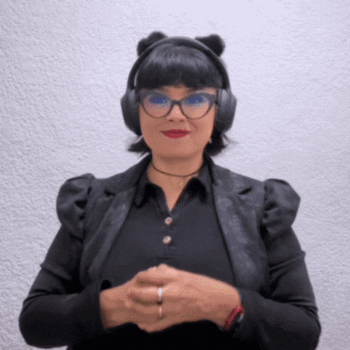 a woman wearing a cat ear headband and glasses