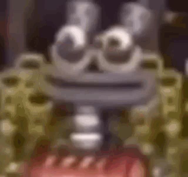 a close up of a cartoon character with a big mouth and a huge nose .