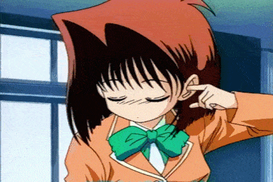 a girl with red hair and a green bow tie is covering her ears with her hand
