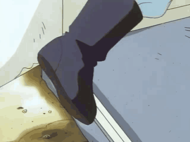 a person 's foot is standing on a staircase with a hole in the floor