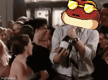 a man with a hot dog on his head is dancing in a crowd of people .