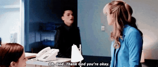 a woman says oh god thank god you 're okay in front of a phone