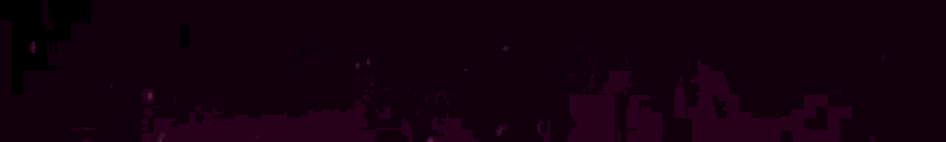 a close up of a pink light beam on a dark background .