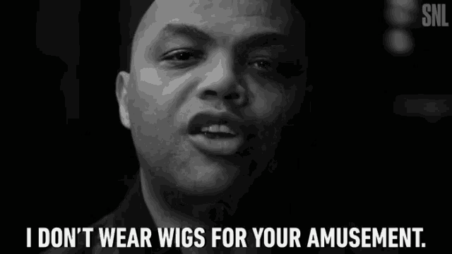 a black and white photo of a woman with an afro and the caption i don t wear wigs for your amusement