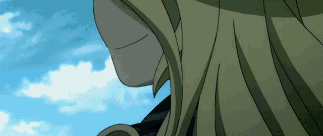 a close up of a person 's face with a blue sky behind them
