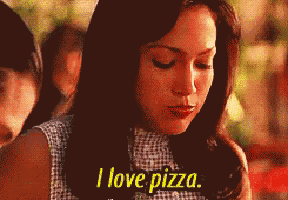 a woman says " i love pizza " while looking down