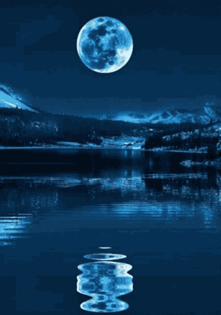 a full moon shines over a lake with snowy mountains in the background