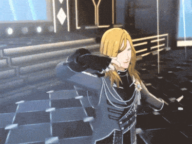 a man with long blonde hair is standing in a dark room with the letter y in the background
